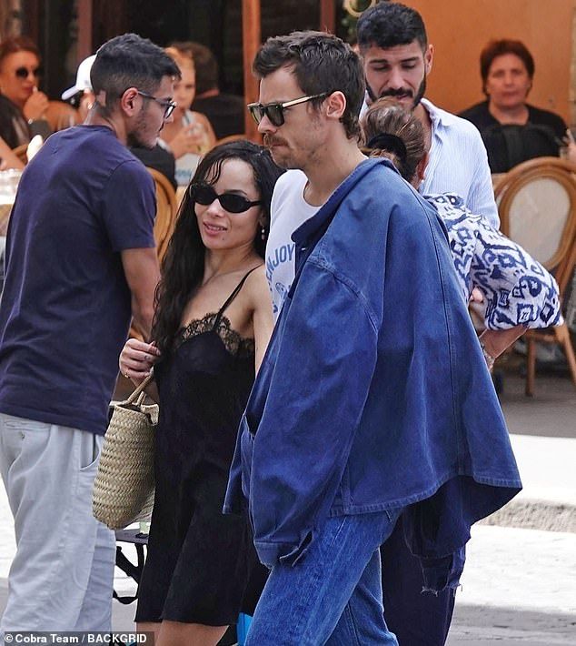 Harry Styles put on a very cosy display with rumoured girlfriend Zo Kravitz on Friday as the pair enjoyed a romantic stroll through the streets of Rome, Italy