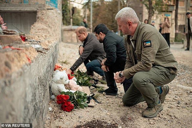 Prince Harry pays tribute to victims killed in recent Russian drone and missile strikes at the site of a heavily damaged apartment building in Kyiv