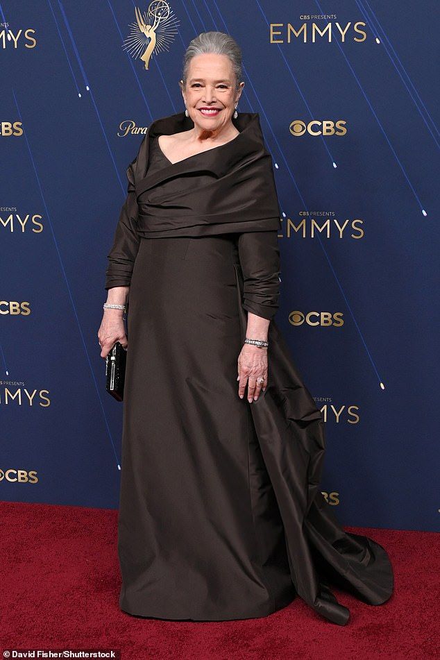 Kathy Bates, 77, enchanted in a dark brown gown, and wore her silver tresses swept up in a stylish updo