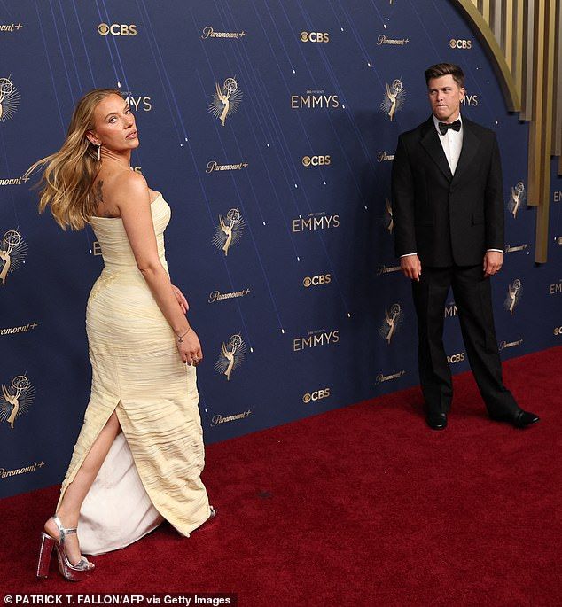 Johansson wore her blonde hair down and bared her floral back tattoo in a strapless pastel-yellow gown selected by stylist Kate Young