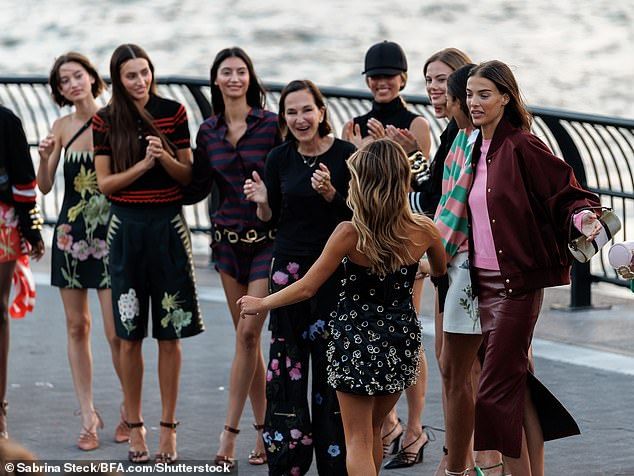 Rowley (center) said her daughter, seen walking towards her, 'killed it' on the runway
