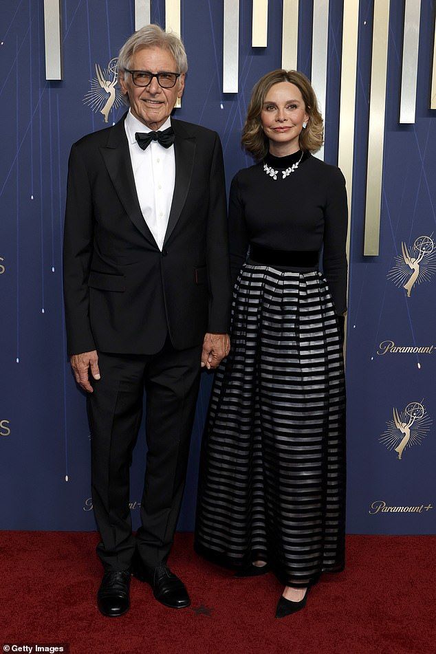 They both wore black as they held hands on the red carpet