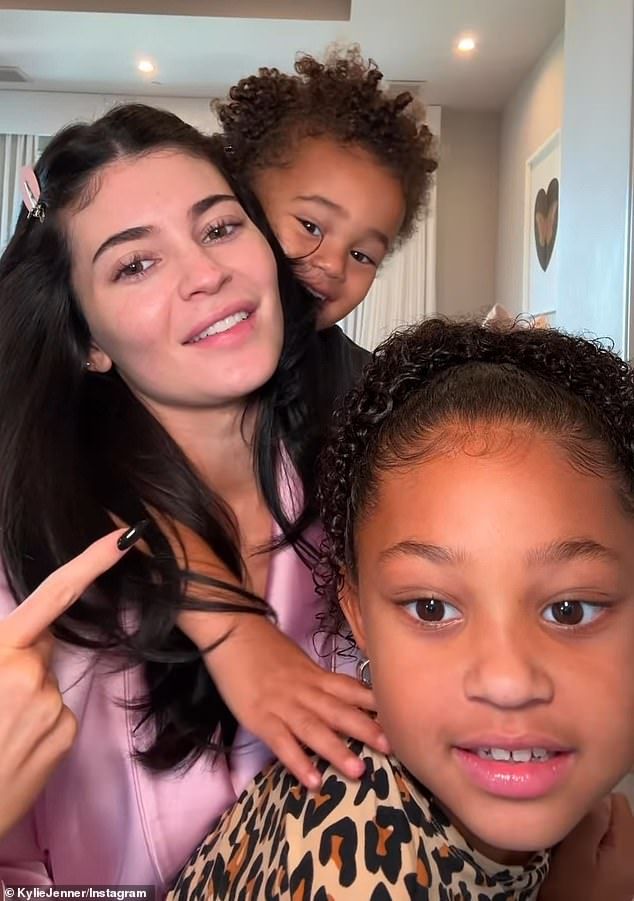 The doting mom instructed her kids to announce 'get ready with us' at the beginning of the clip, and she used the phrase as her caption