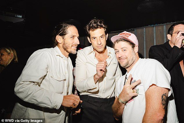 Mark (C) partied the night away with his pals