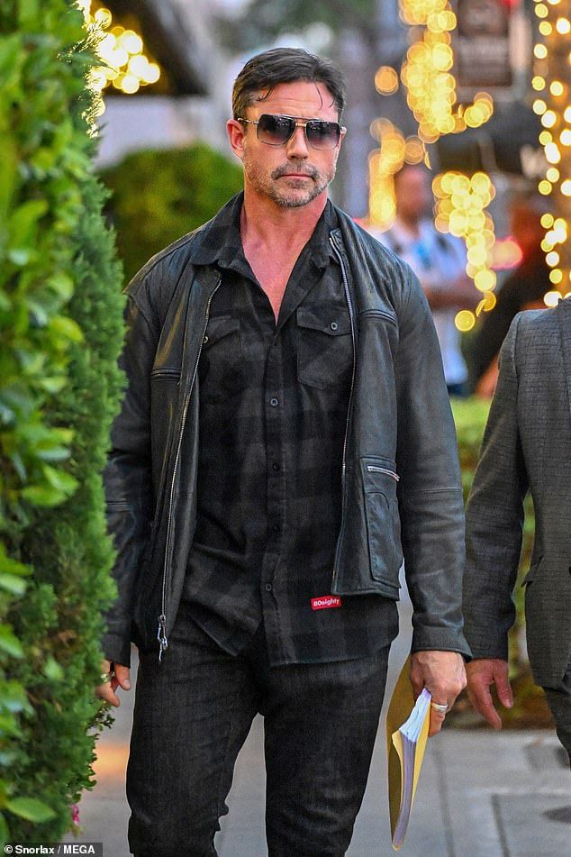 Meanwhile her estranged husband was pictured walking in Beverly Hills with his lawyer