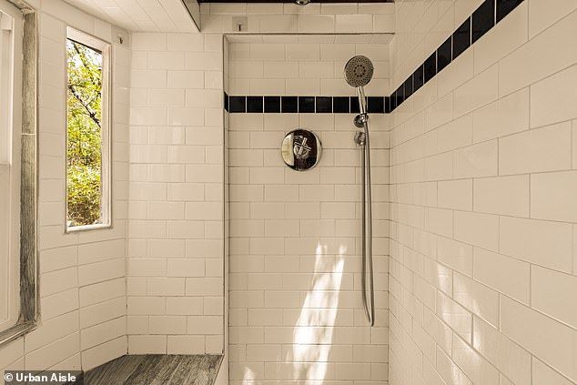 A shower in the home's only bathroom is pictured above
