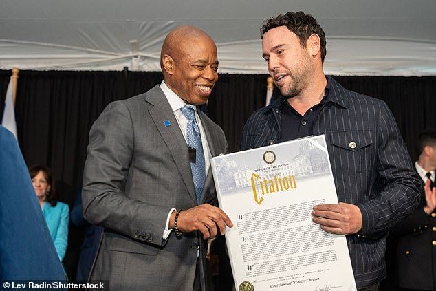 In contrast, Scooter is a Democrat, having hosted a fundraiser for Hillary Clinton at his home in 2015 (pictured withmayor Eric Adams in 2024)