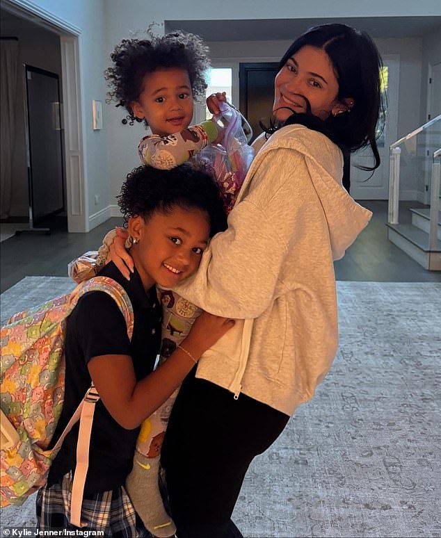 In one of the images, Jenner could be seen flashing a cheerful smile while embracing her kids