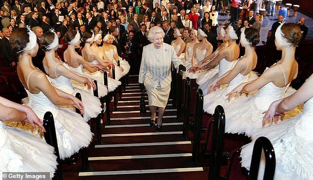 The Queen who famously took the steps at Balmoral two at a time, proves her fitness as she climbs a stairway to meet ballerinas at the Royal Albert Hall in 2004