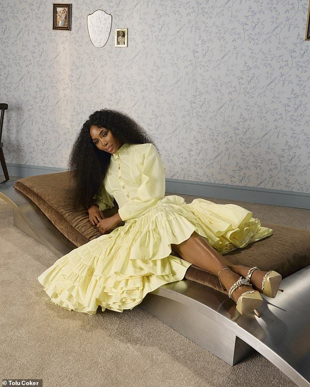 She also boasted timeless glamour in a lemon yellow gown that featured a high collar and long sleeves with yellow diamond embellished heels as she lay on a modern curved flatbed