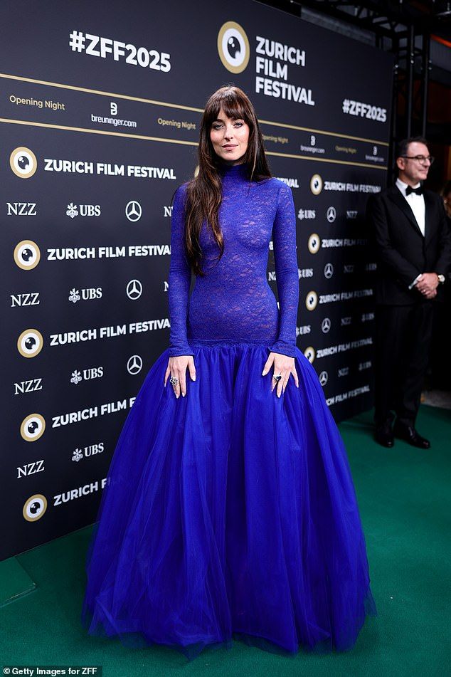 Dakota Johnson had another 'naked dress' moment as she stepped out in a risqu lace gown at the 21st Zurich Film Festival on Thursday