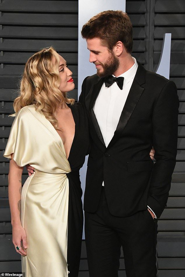 Less than one year after marrying, Cyrus and Hemsworth announced their split in August 2019 - with The Hunger Games actor filing for divorce shortly after while citing 'irreconcilable differences'; seen in 2018 in Beverly Hills