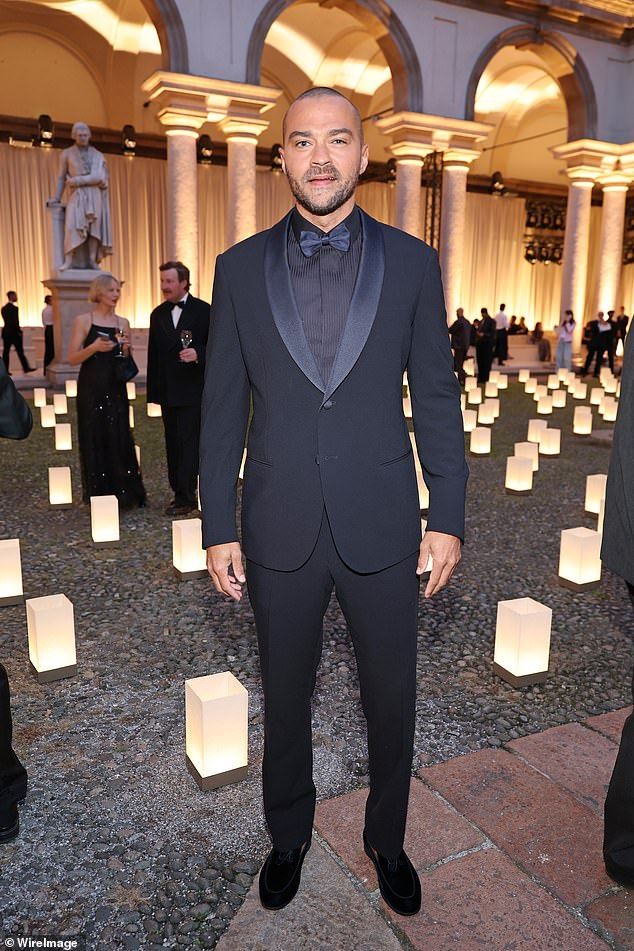 Jesse Williams looked smart in a tuxedo with a pinstriped satin shirt