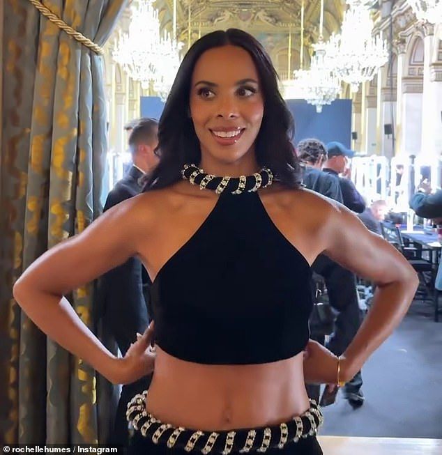 The longtime brand ambassador woed in a jewelled black and silver look, complete with a revealing halterneck crop top