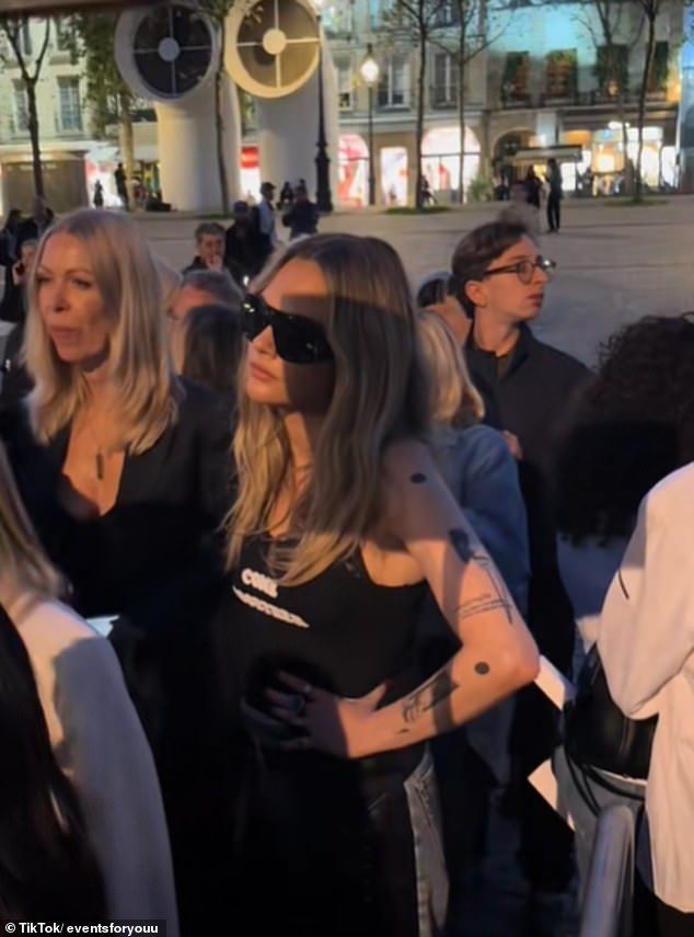 Cara Delevingne looked less than impressed as she was forced to wait in line before entering the Stella McCartney show during Paris Fashion Week on Tuesday