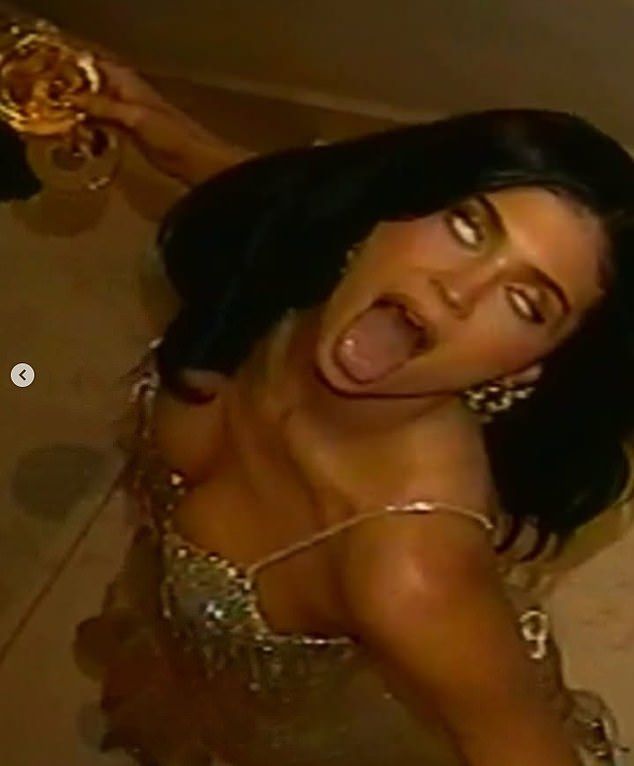 The reality TV star had a glass of champagne in her hand as she partied hard with her older sister Kendall, a supermodel, who was working the Schiaparelli show. In one of the images the Kylie Cosmetics founder looked to be having the time of her life as s