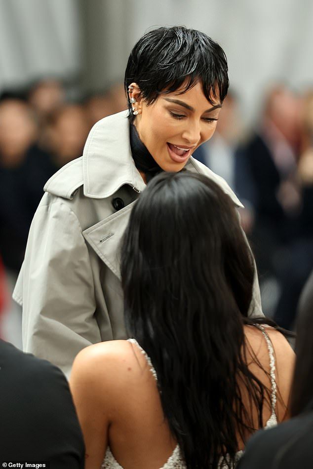 She was seen arriving at the event before greeting sister Kylie Jenner, who caught the eye in a white knitted co-ord