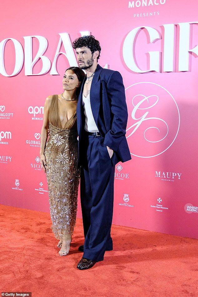 The actress, 50, flaunted her incredible figure in a dazzling tulle gown covered in intricate beading and dripping with glittering jewels