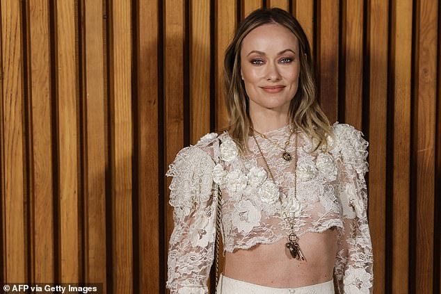 Olivia led the celebrity arrivals and flashed her abs in a white lace co-ord which displayed her gym-honed physique