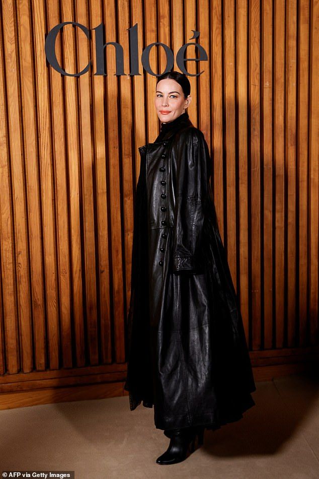 She added heeled leather boots to her look