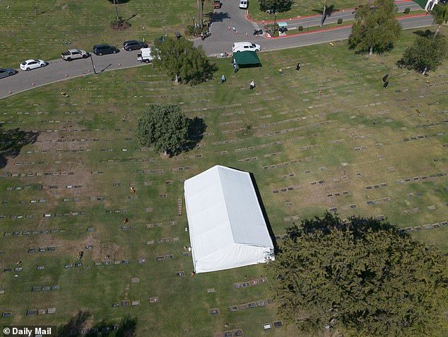 The funeral appeared to be conducted under the tent, which was pictured from above
