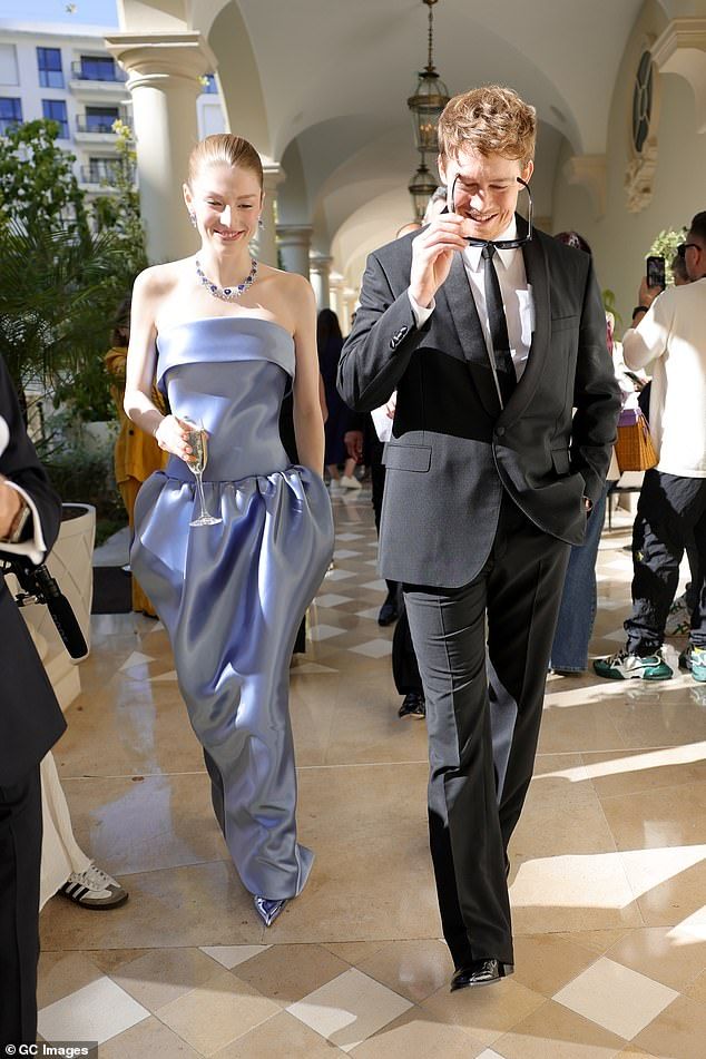 'can i start a rumor,' the user wrote playfully before suggesting a connection between Alwyn, 34, and his former costar Hunter Schafer, 26; pictured together in Cannes, France, in May 2024