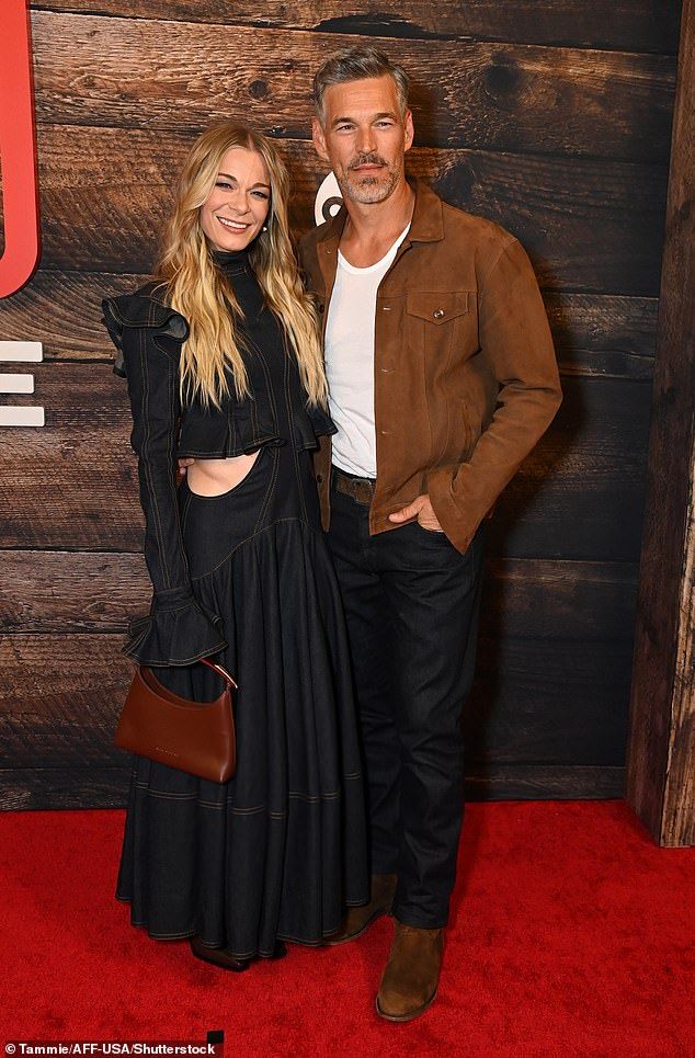 LeAnn Rimes put on a loved-up display with husband Eddie Cibrian on Tuesday, as the couple made a rare red carpet appearance together at the premiere of 9-1-1: Nashville at PROOF Rooftop in Tennessee
