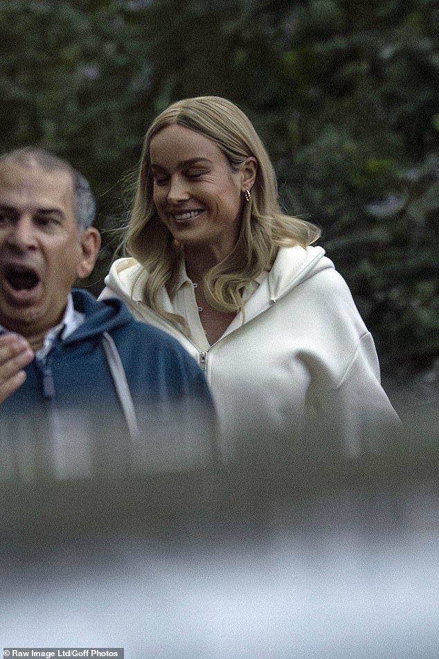 Brie wore a comfortable white hoodie for the day of filming
