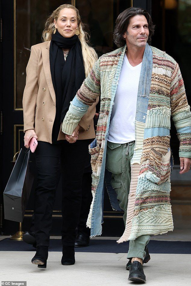 The lovebirds holding hands while leaving a hotel during the Womenswear Spring Summer 2026 as part of Paris Fashion Week on October 3