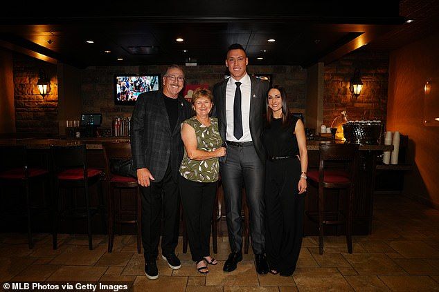 Judge is pictured with his wife (right), and parents Patty (second from left) and Wayne (left), in October 2023