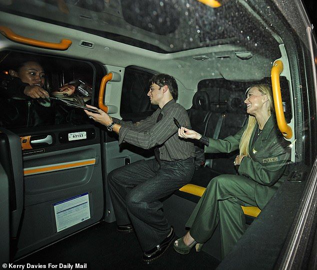 Emma and Beau signed autographs for fans from their taxi