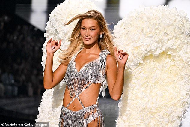 She wore an opaque white bra decorated with tassels covered with silver sequins