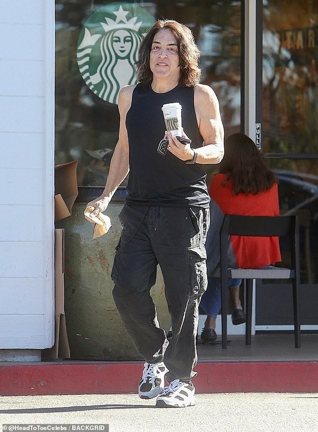 Dressed in a black tank top and matching pants, the rocker cut a somber figure  fitting for a man who had just said he was 'devastated by the passing of Frehley' in his emotional tribute