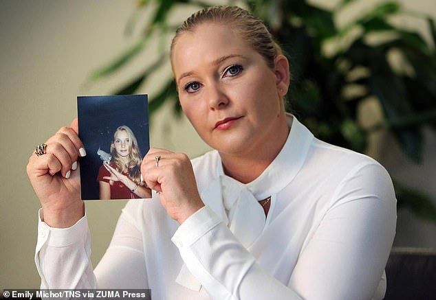 Prince Andrew's sex accuser Virginia Giuffre (pictured with a photo of herself as a teen) lost a baby days after having an orgy with Prince Andrew and eight other girls, her tell-all memoir claims