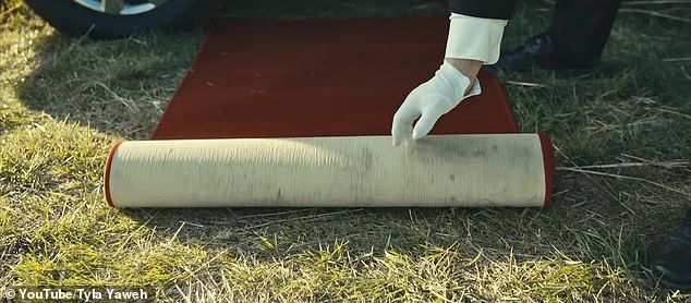 In the video, Deuel appears as a limousine driver and is shown rolling out a red carpet in front of the luxury vehicle before opening the door for Yaweh