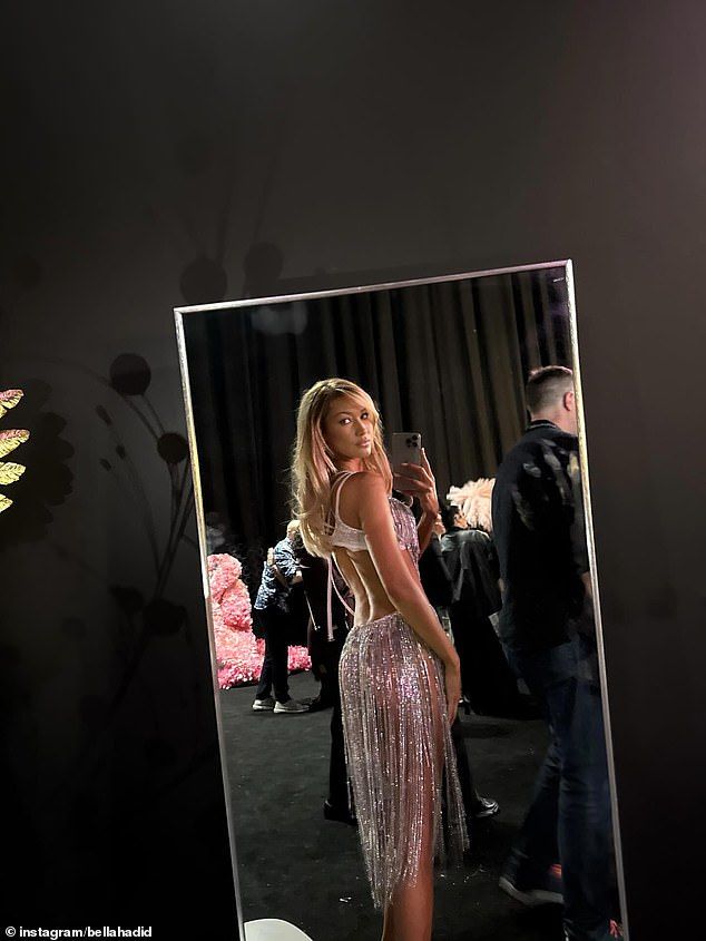Bella also looked pretty in white as she wore glittery, tasselled lingerie and added inches to her statuesque frame with nude heels