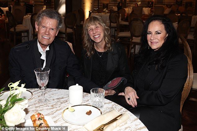 The 66-year-old was all smiled as he mingled at the event with his wife and friends