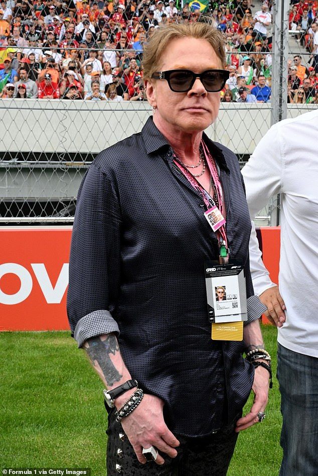 The reason Rose was angry on stage was because he could only hear a percussion instruments in his earpiece. Pictured in August in Hungary