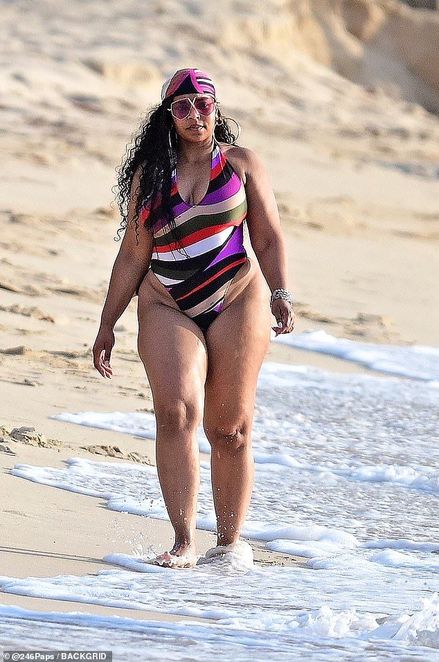 Ashanti, 45, put her hourglass curves on display while enjoying a beach day in Bridgetown, Barbados
