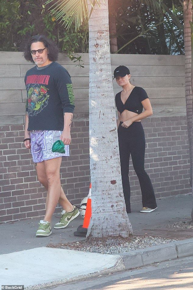 Quelling any concern of trouble in paradise, the TV host stayed close to the 48-year-old actor's side as they stepped out together on a walk with their beloved Chihuahua